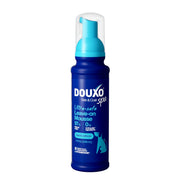 Douxo mousse emballage avant montrant le flacon sécurisé et les bénéfices apaisants