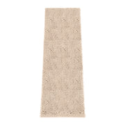 HOMEK tapis face entière montrant surface absorbante et design beige