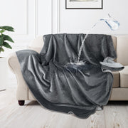 LOOBANI vue du plaid gris posé sur un canapé, protège et embellit