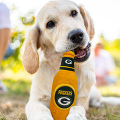 Pets First chien jouant avec la bouteille NFL stimulant exercice ludique