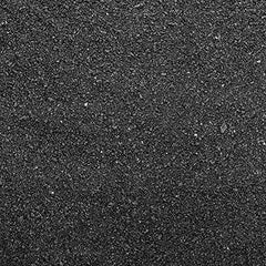 Seachem Flourite Black Sand gros plan des grains noirs montrant texture idéale pour racines