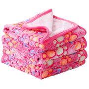Tatuo plaid face avant montrant motif patte et protection mobilier
