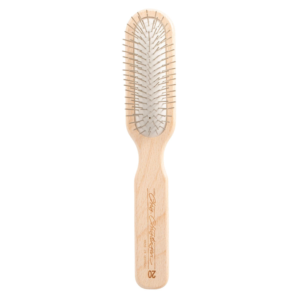 Chris Christensen brosse oblong face montrant tête et picots, résultat professionnel