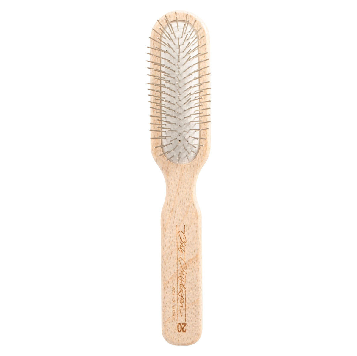 Chris Christensen brosse oblong face montrant tête et picots, résultat professionnel