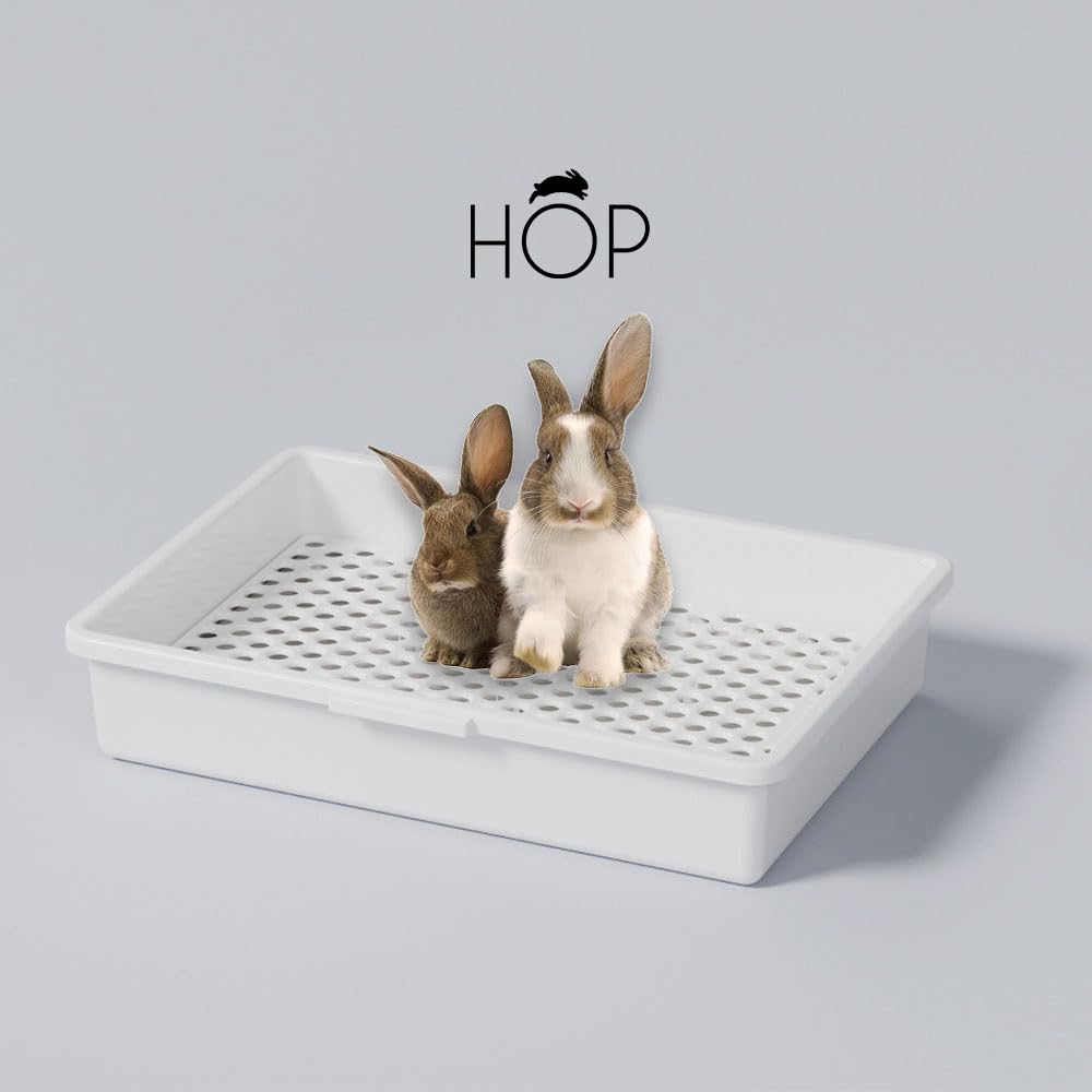 HOP grille en usage dans bac gardant les pattes sèches et le foin propre