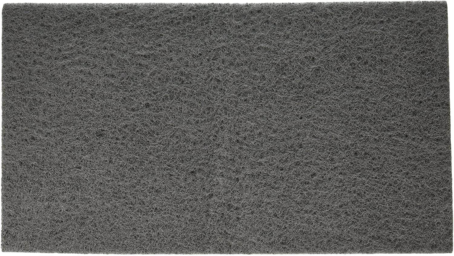 PENN-PLAX coussin 10x18 posé à côté d'une règle pour rapport dimensionnel