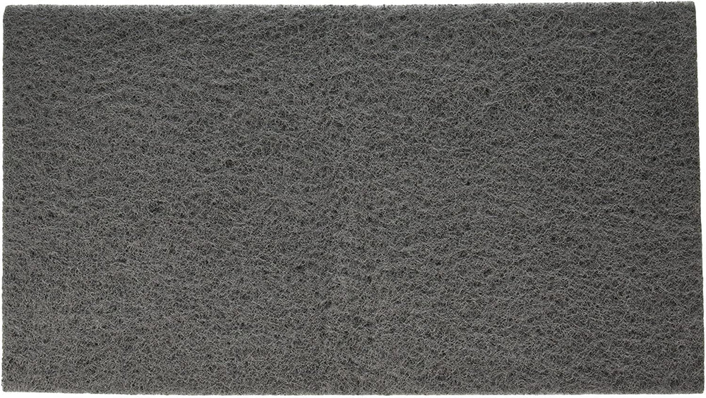 PENN-PLAX coussin 10x18 posé à côté d'une règle pour rapport dimensionnel