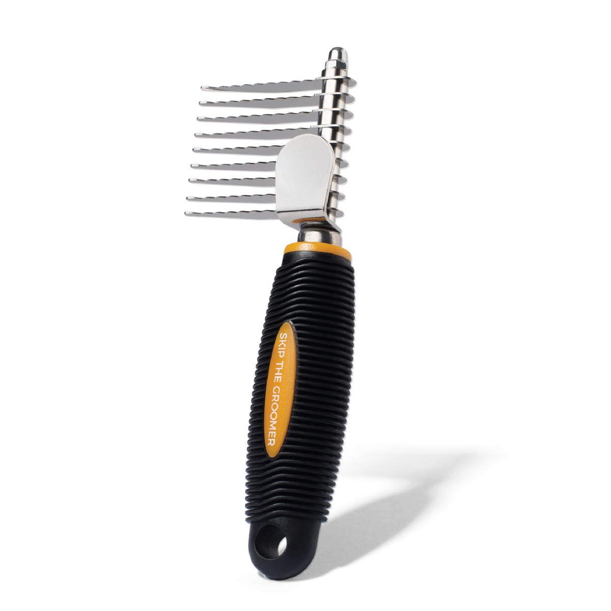 Skip the Groomer brosse face avant montrant design et prise confortable