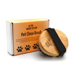The Buddy System brosse paume face avant montrant design ergonomique et prise confortable