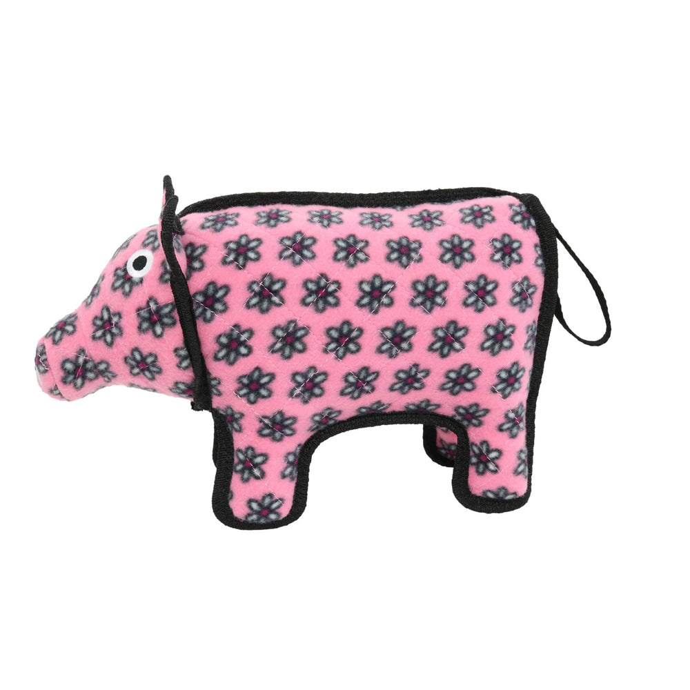 TUFFY jouet Pig à côté d’un objet pour comparaison de taille claire