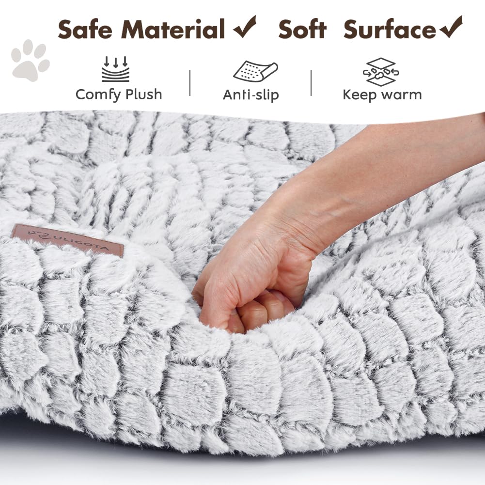 ULIGOTA coussin installé dans une caisse avec petit chien, confort stable