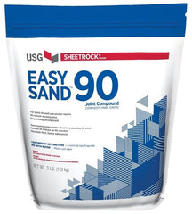 U S GYPSUM sac USG Easy Sand montrant l'emballage et facilité d'utilisation
