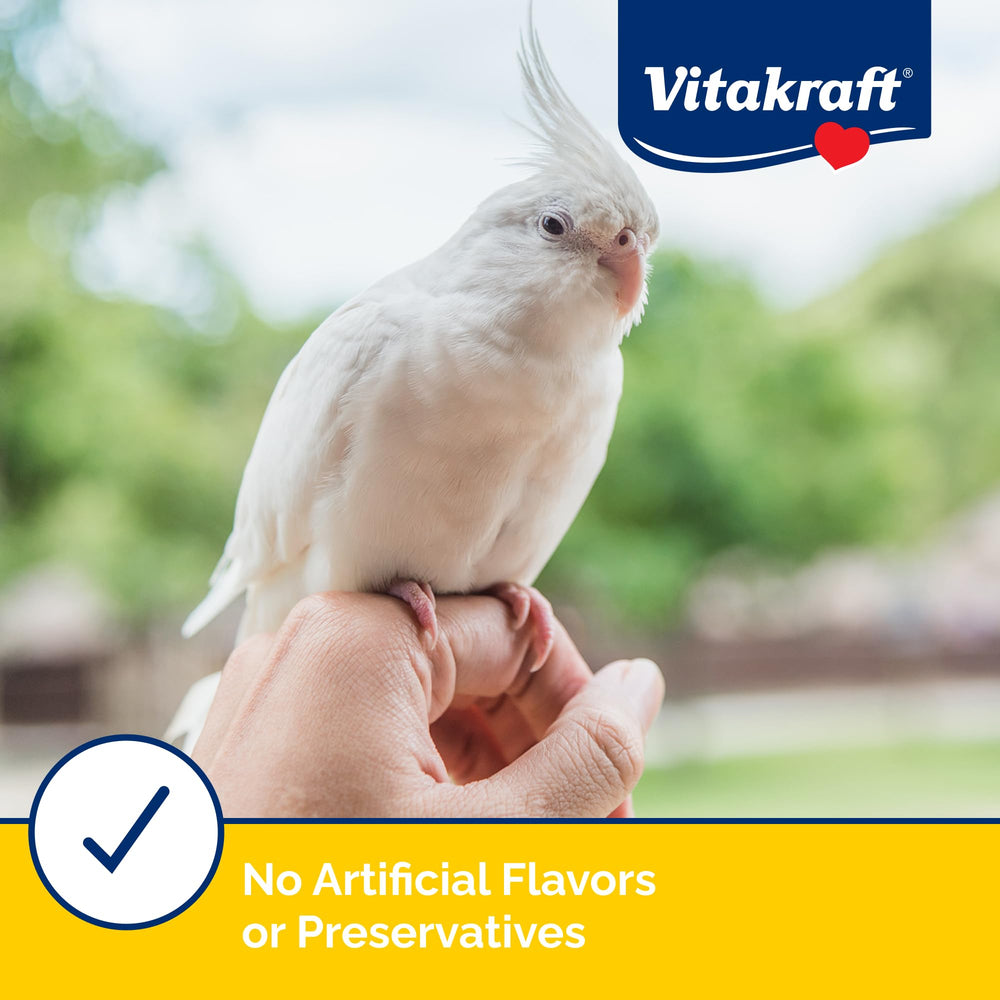 Vitakraft sachet à côté d'un ruban métrique pour comparaison de taille pratique