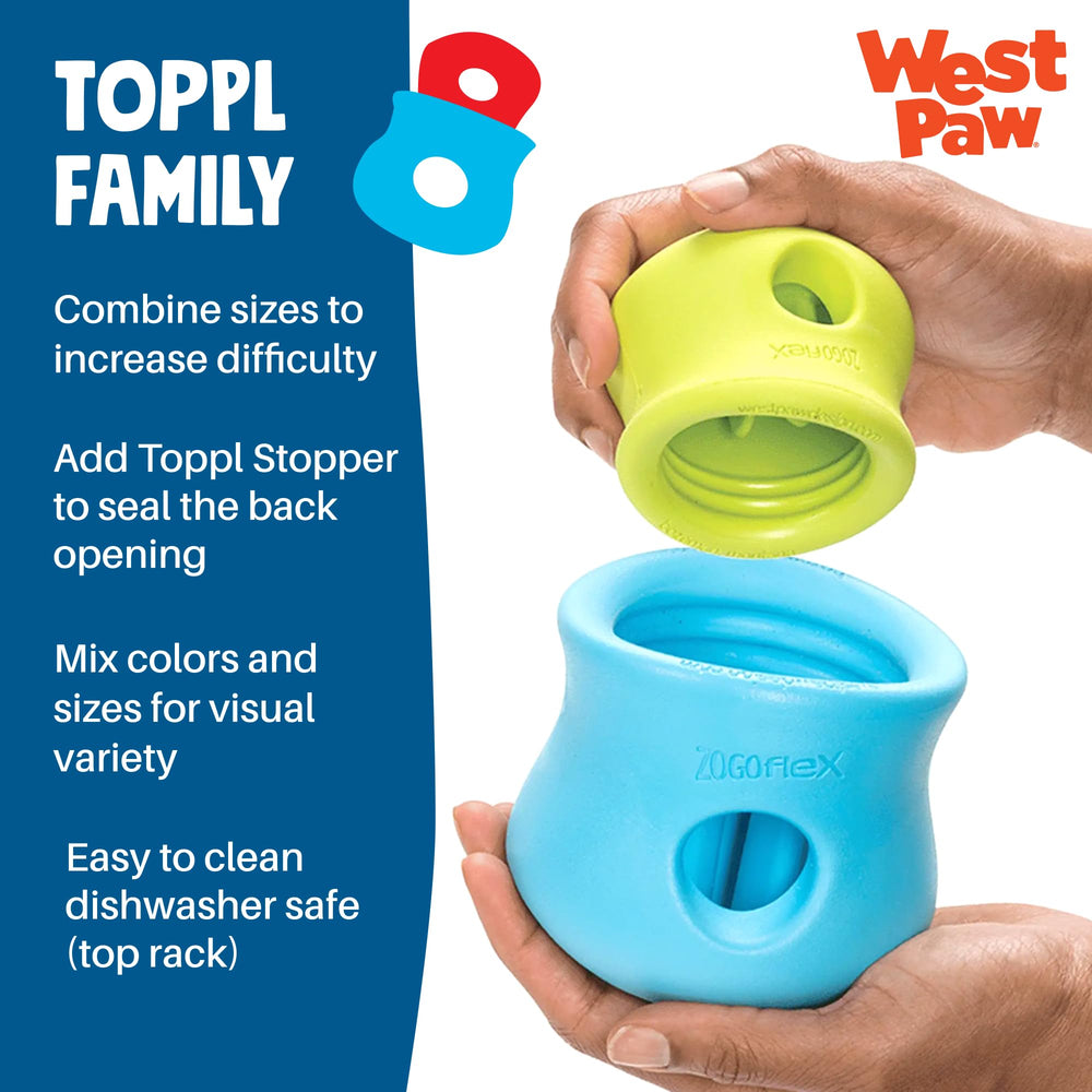 WEST PAW Toppl posé à côté d'une main pour comparer la taille et l'ergonomie