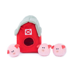 ZippyPaws trois cochons Miniz en main illustrant la récompense sonore